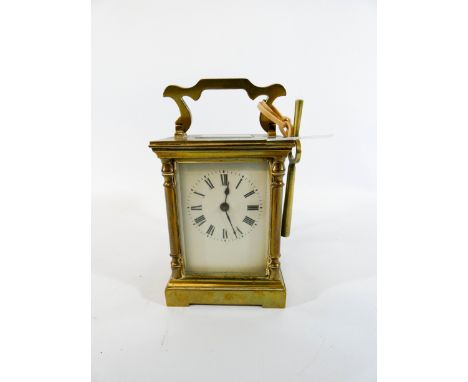 A French gilt brass carriage clock with key, height with handle up 16cm 