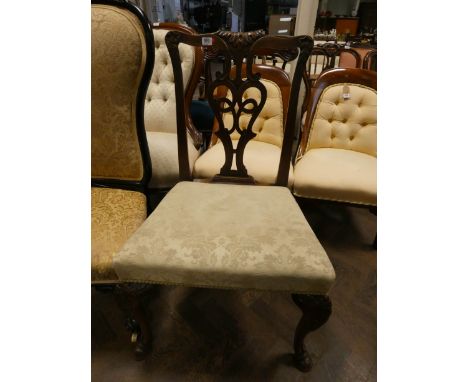 A Chippendale style mahogany elbow chair on cabriole legs with hoof feet and upholstered seat 
