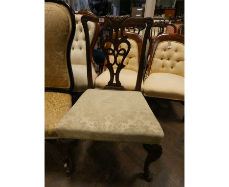 A Chippendale style mahogany elbow chair on cabriole legs with hoof feet and upholstered seat 