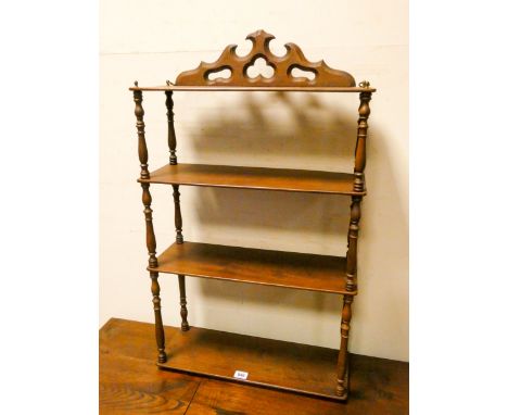 A four tier mahogany shelf unit 19" wide 