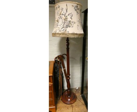 A mahogany reeded column standard lamp with floral shade 