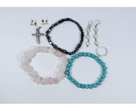 A collection of jewellery to include three beaded bracelets, three pairs of earrings, a cross pendant and marked .925 silver 