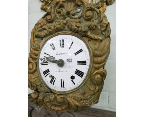 Two old French brass embossed wall clocks with striking movements and enamel faces (both have no weights or pendulums)