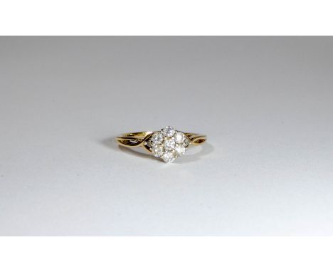 Pretty seven stone diamond daisy cluster ring, on 9ct gold shank, ring size L