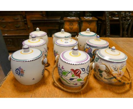 Nine assorted Poole Pottery biscuit barrels