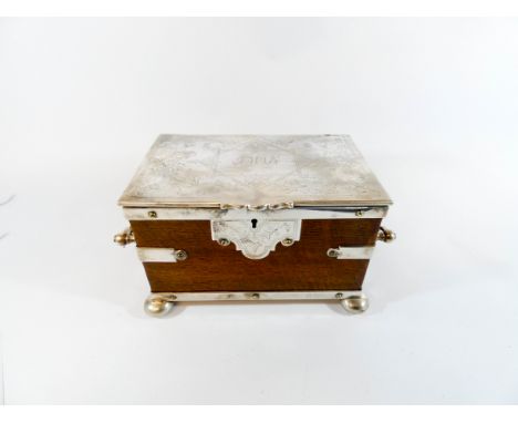 A good Victorian silver plated and oak bound tea caddy of rectangular form with a faint inscription to the lid dated 1883, wi
