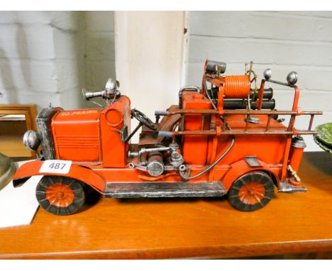 A tin plate model fire engine 