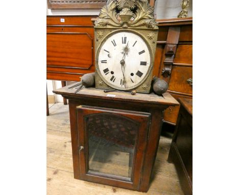 A French striking wall clock with circular enamel dial with a glazed cabinet which it fits in