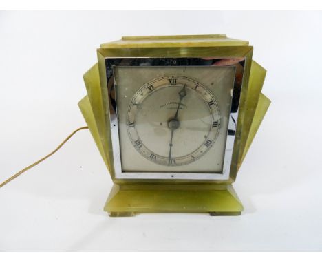 An Art Deco green onyx mantel clock with electrical work dial signed Penlington, height 17cm 
