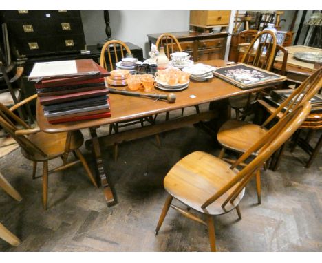 Ercol Golden Dawn dining room suite comprising refectory style table, six stick back Windsor style dining chairs, four standa