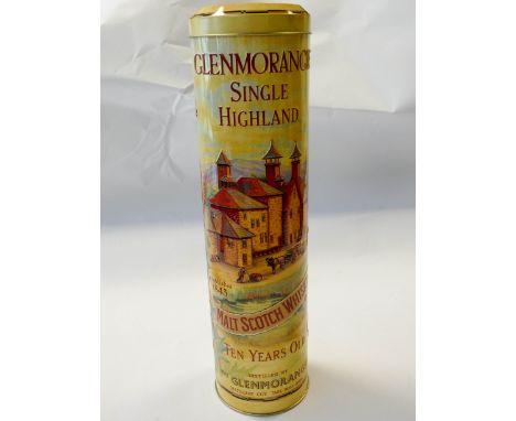 A bottle of Glenmorangie Single Highland 10 years old malt Scotch whisky unopened in its tin