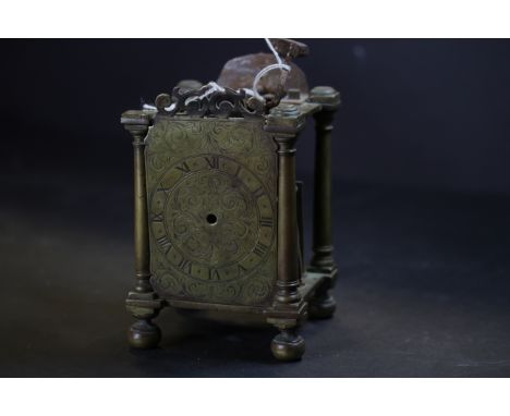 Early 18th Century brass Lantern Clock mechanism, retaining face but lacking hand, bell and sides, 18.5cm high