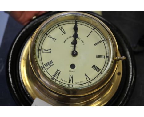 Brass ship bulkhead 8-day clock, (dimensions 7.5”), hanging bracket