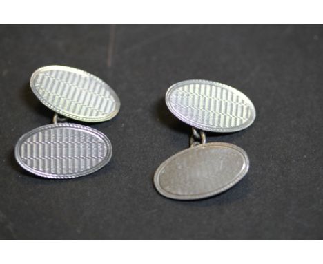 Pair of early 20th Century gents silver cufflinks with engine turned oval faces