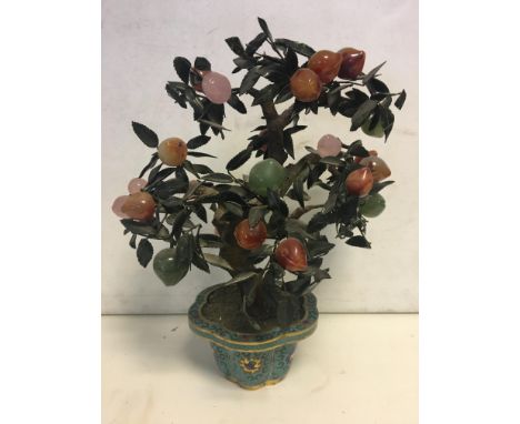 An oriental hardstone peachtree, the fruits carved in rose quartz, carnelian, agate, jade and others,in a cloisonne lobed pot