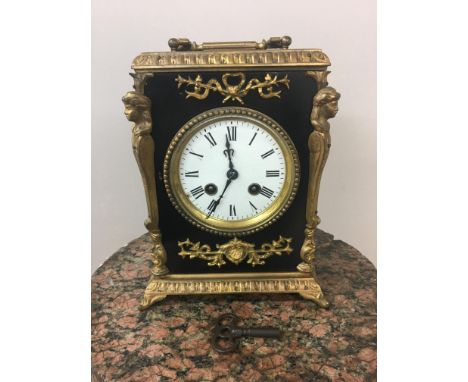 19th c French ebonised and gilt mantle clock, striking on bell. 22cm x 18cm x 13cm.