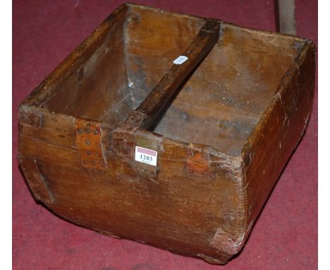 An Eastern stained wood and metal bound grain trough, width 34.5cm