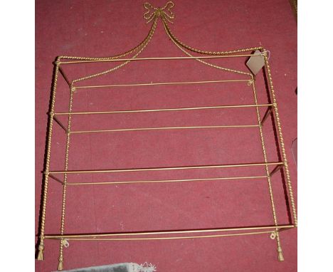 A gilt painted wirework four tier hanging wall shelf, having removable glass shelves, w.78cm