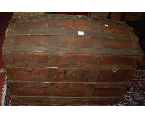 A circa 1900 stained wood and metal bound domed hinged top travelling trunk, w.81cm