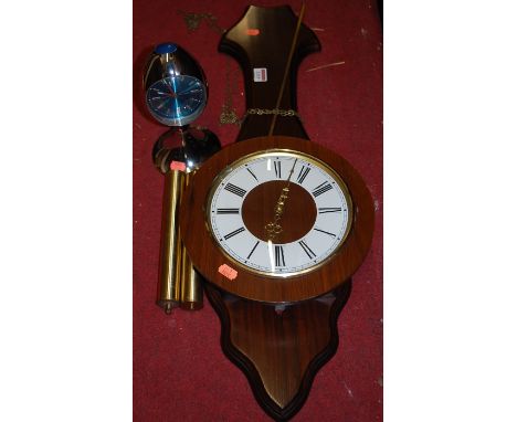 A reproduction mahogany wall clock, having twin weight driven movement with pendulum, together with a 1980s chromed metal Wes