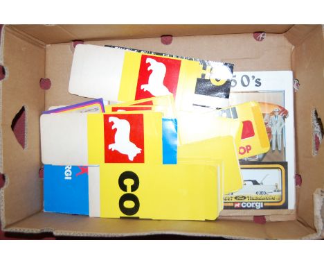 One box containing a quantity of vintage Corgi point of sale advertising signs and equipment