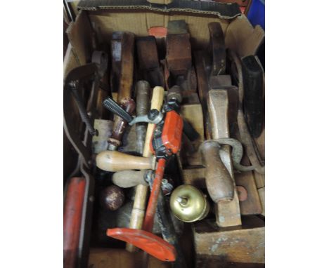 A box of vintage tools including planes, hand drill etc