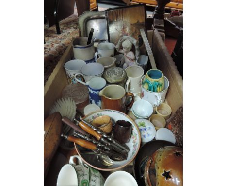 A box of ceramics, vintage nut crackers, shoe strechers etc