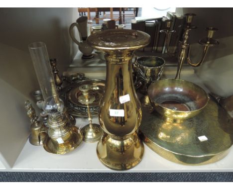 A selection of brassware including oil lamp, candlestick's, horse brasses etc