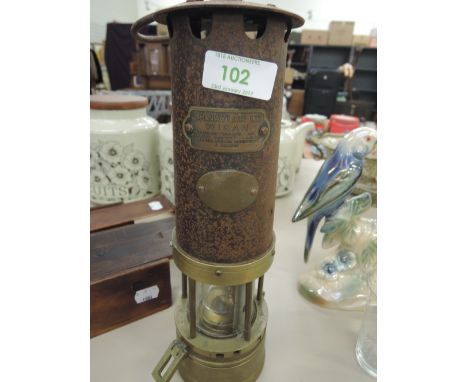 A brass based miners lamp by J H Naylor Ltd, Wigan manufacturers of Miners Safety Lamps, Gun Metal Boiler Mountings & Valves 
