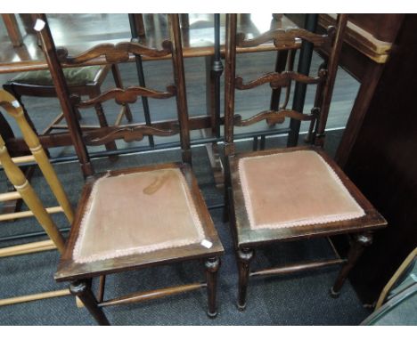Two scrolled ladder back bedroom chairs
