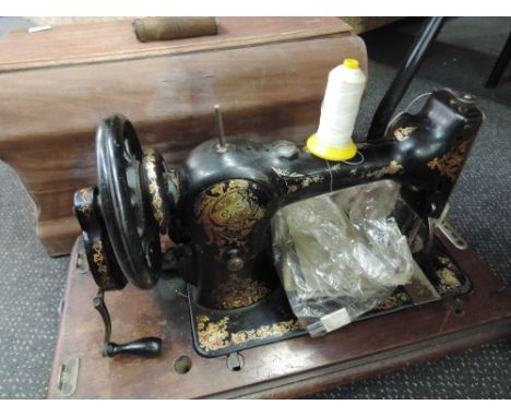 A vintage hand turned Jones C S sewing machine No79914