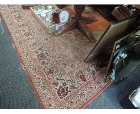 A large vintage carpet square, red ground