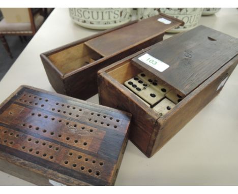 A boxed set of vintage dominoes, draughts and cribbage