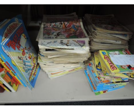 A shelf of late 20th century Dandy, Beano and similar comics and annuals including Dandy Cartoon book No1 etc