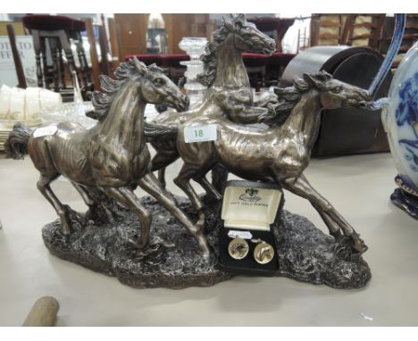 A modern resin study modelled as galloping horses with a bronzed finish and a pair of gold plated cufflinks