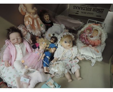 A shelf of modern collectors baby dolls