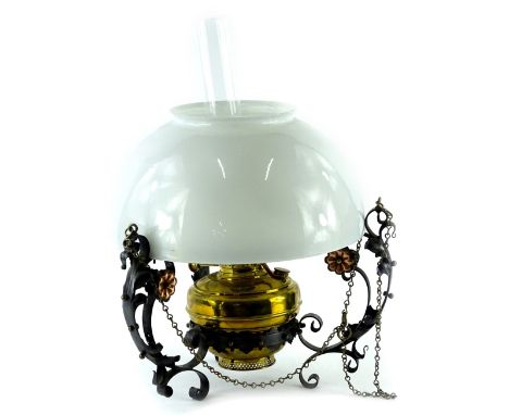 An Arts and Crafts type wrought iron ceiling oil lamp with opaque glass shade etc., 38cm W.