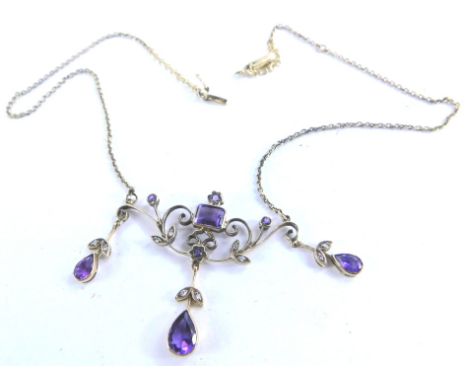 An Art Nouveau design amethyst and diamond pendant, with tiered design of ten diamonds and eight amethyst stones, the amethys