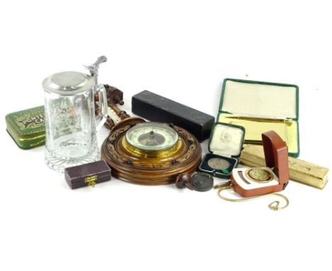 A collection of items, to include an aneroid barometer, various medallions, an Otis King's patent calculator, glass tankard e