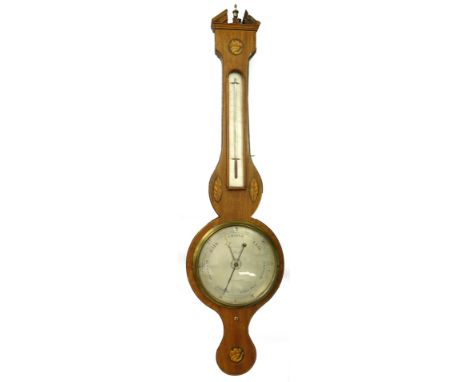 L and D Soleha, Hull. A mid 19thC mahogany boxwood and ebony strung wheel barometer, with engraved dial, inlaid with shells e