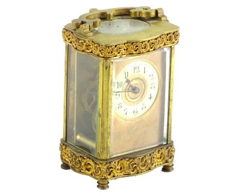 A late 19thC French carriage timepiece, the gilt brass case decorated with scrolls etc., the enamel dial with Arabic numerals
