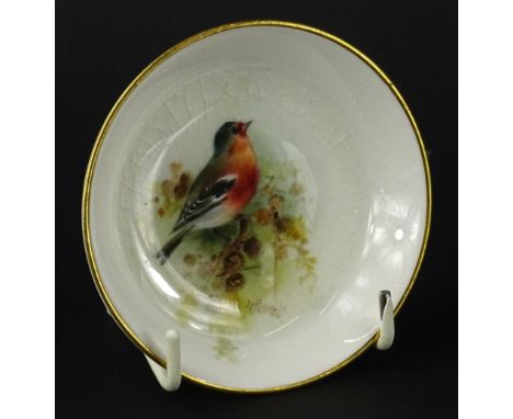 A Royal Worcester pin tray, painted with a chaffinch by Powell, printed mark in puce to underside, 9cm dia.