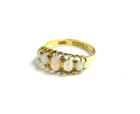 An 18ct gold opal set dress ring, set with five opal stones in claw setting, with pierced borders, maker's stamp H.W.Ltd, Bir