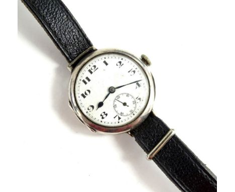 A vintage gent's silver wristwatch, with white enamel dial, black numbering, blue hands, seconds dial, on thin black leather 