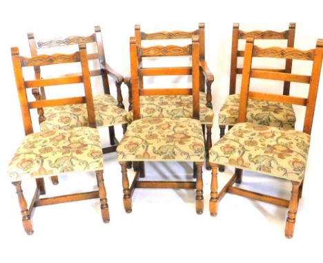 A set of ten oak dining chairs, in 17thC style, each with a carved ladder back, padded seat on turned legs with H stretcher.