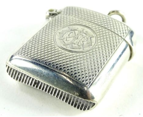 A late Victorian engine turned silver Vesta case, the oval cartouche engraved with a monogram Birmingham 1900 by A and J Zimm