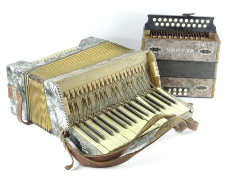 A Hohner small piano accordion and another bearing name Lombardi (AF).