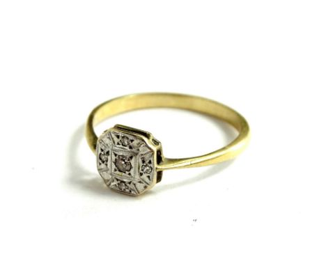 An Art Deco dress ring, with octagonal ring head, illusion set with tiny diamonds, in platinum, on a thin band, yellow metal,