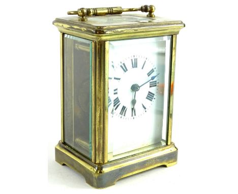 An early 20thC French brass carriage timepiece, with white enamel dial, 13cm H.