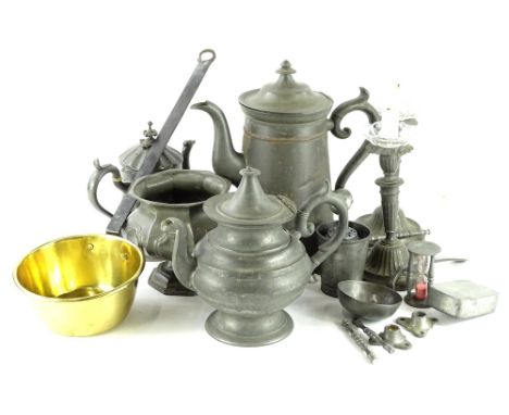 A large quantity of 19thC and later pewter, to include a large hot water jug, a pair of candlesticks, a teapot, hour glass, r